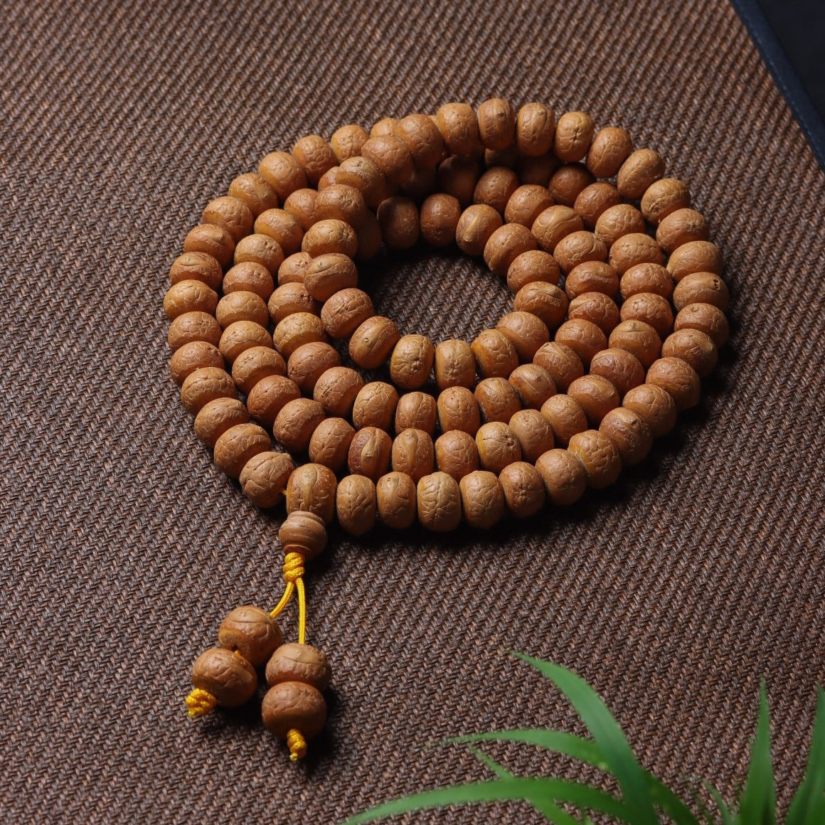 Fengyan Bodhi 108-bead mala prayer strand with warm brown seed beads and yellow cord tassel