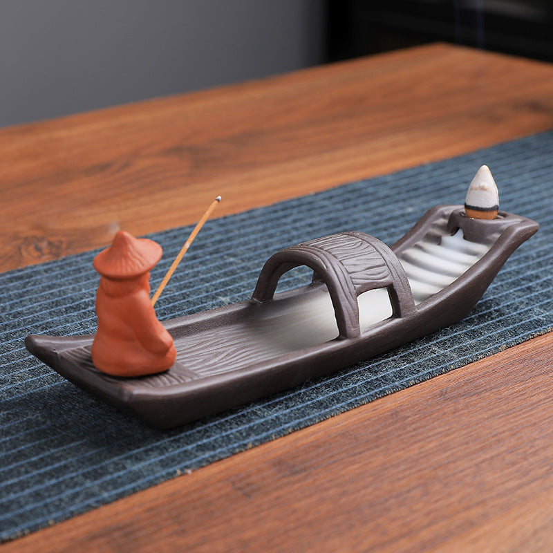 Traditional fisherman boat incense holder in dark ceramic finish