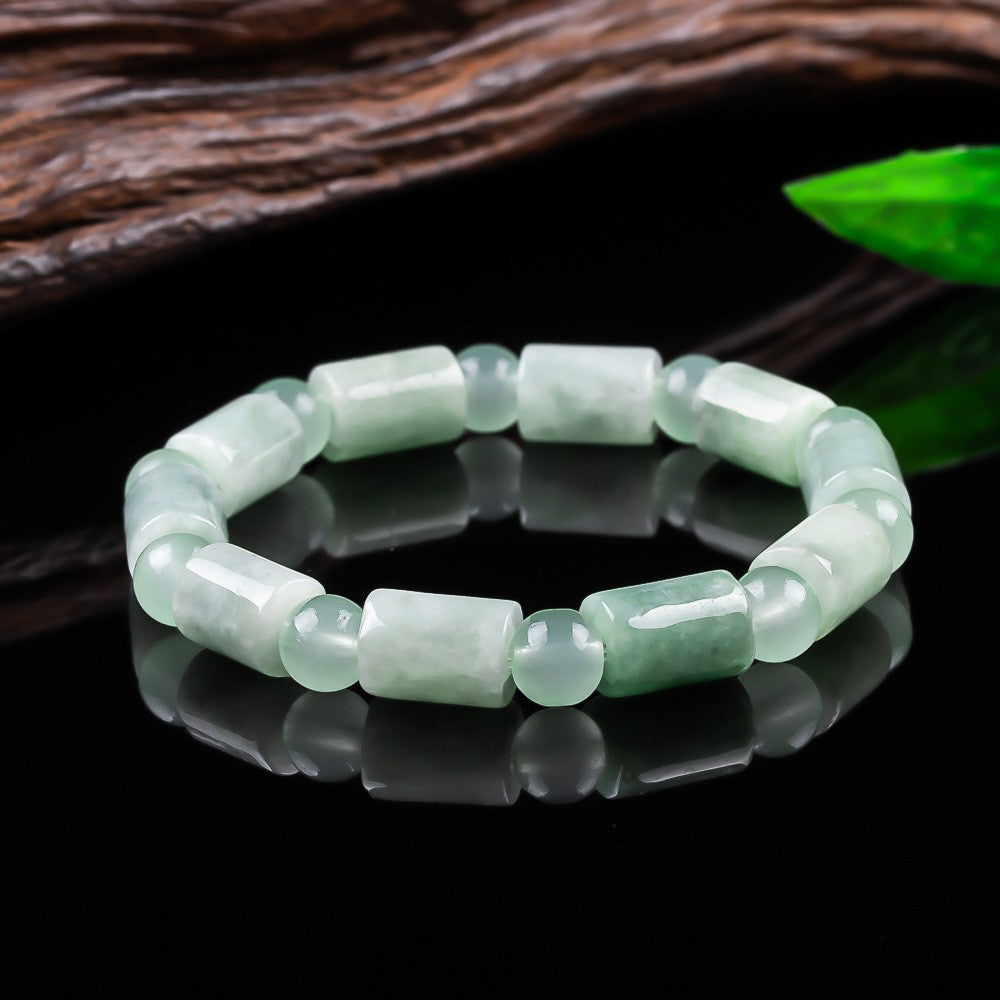 Floating green jadeite barrel and round bead bracelet detail