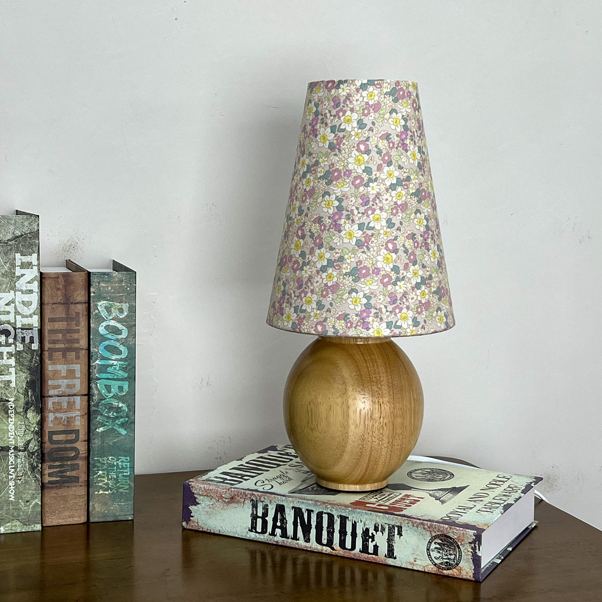 Natural wood sphere table lamp with pastel floral pleated shade