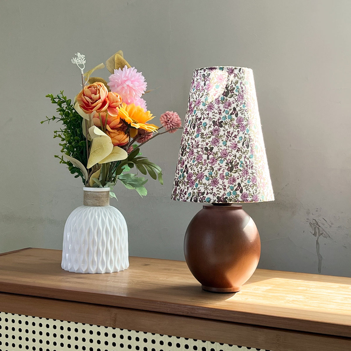 Walnut wood sphere table lamp with purple floral pleated shade