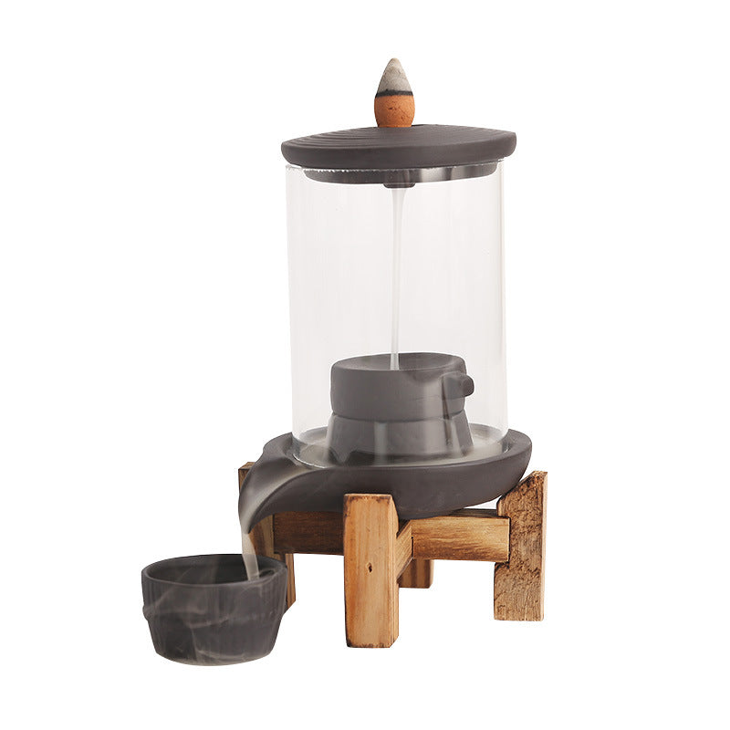 Glass chamber backflow incense burner cutout view with purple clay waterfall basin