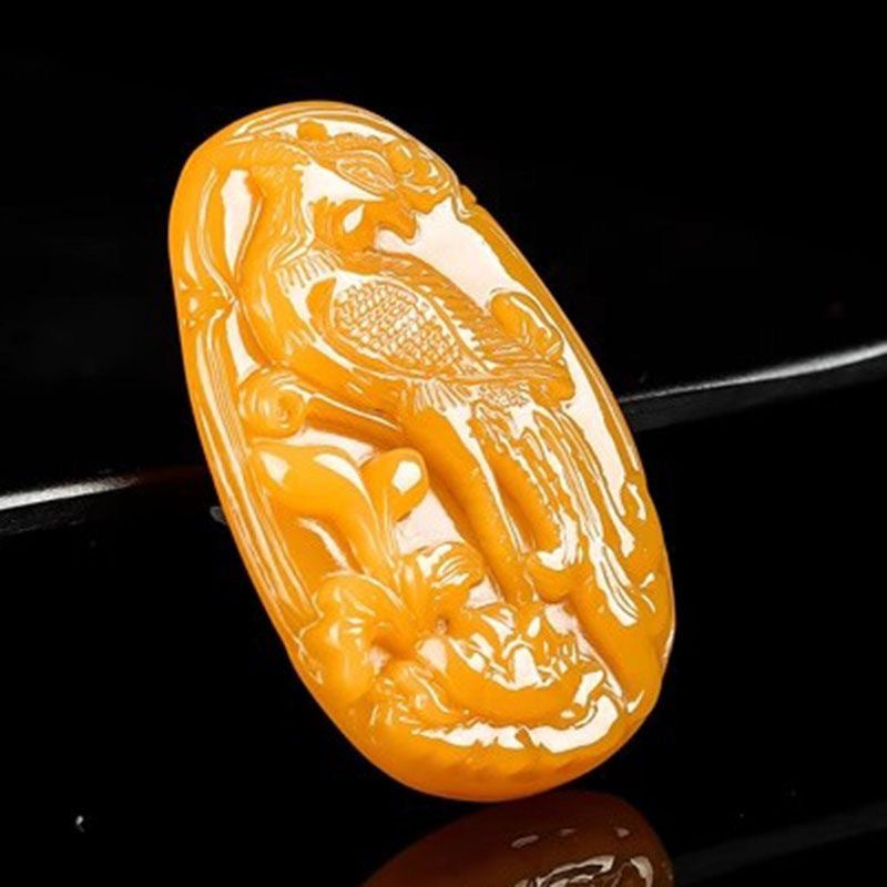 Chinese phoenix relief pendant close view in golden yellow stone