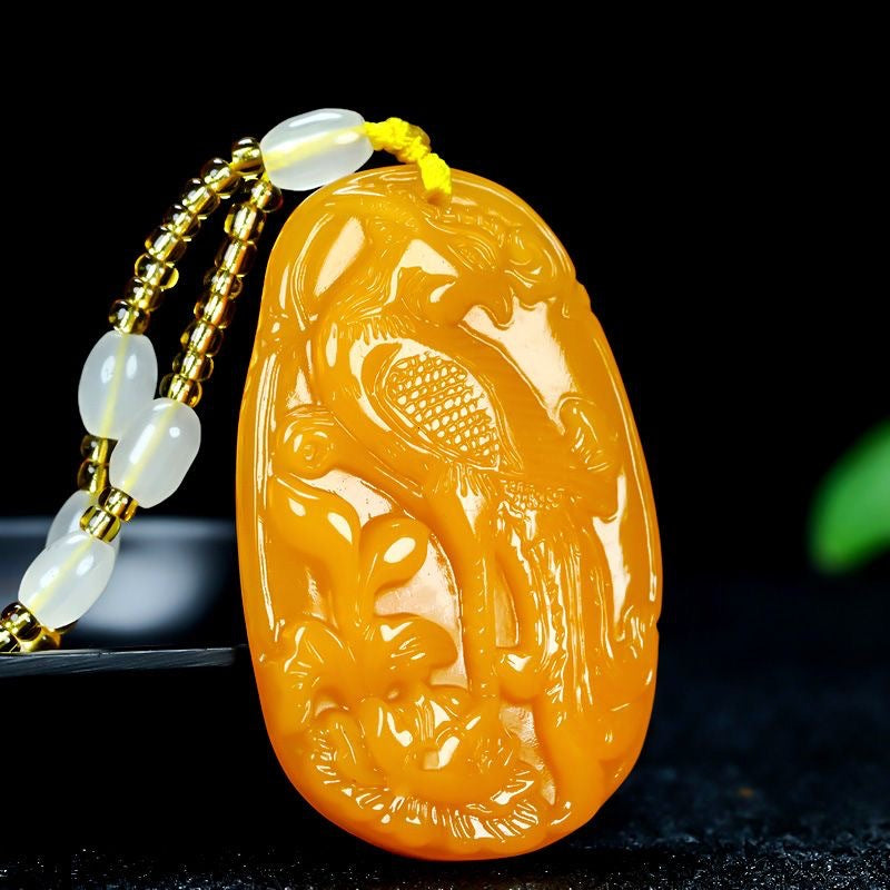 Golden yellow phoenix amulet pendant with braided necklace cord