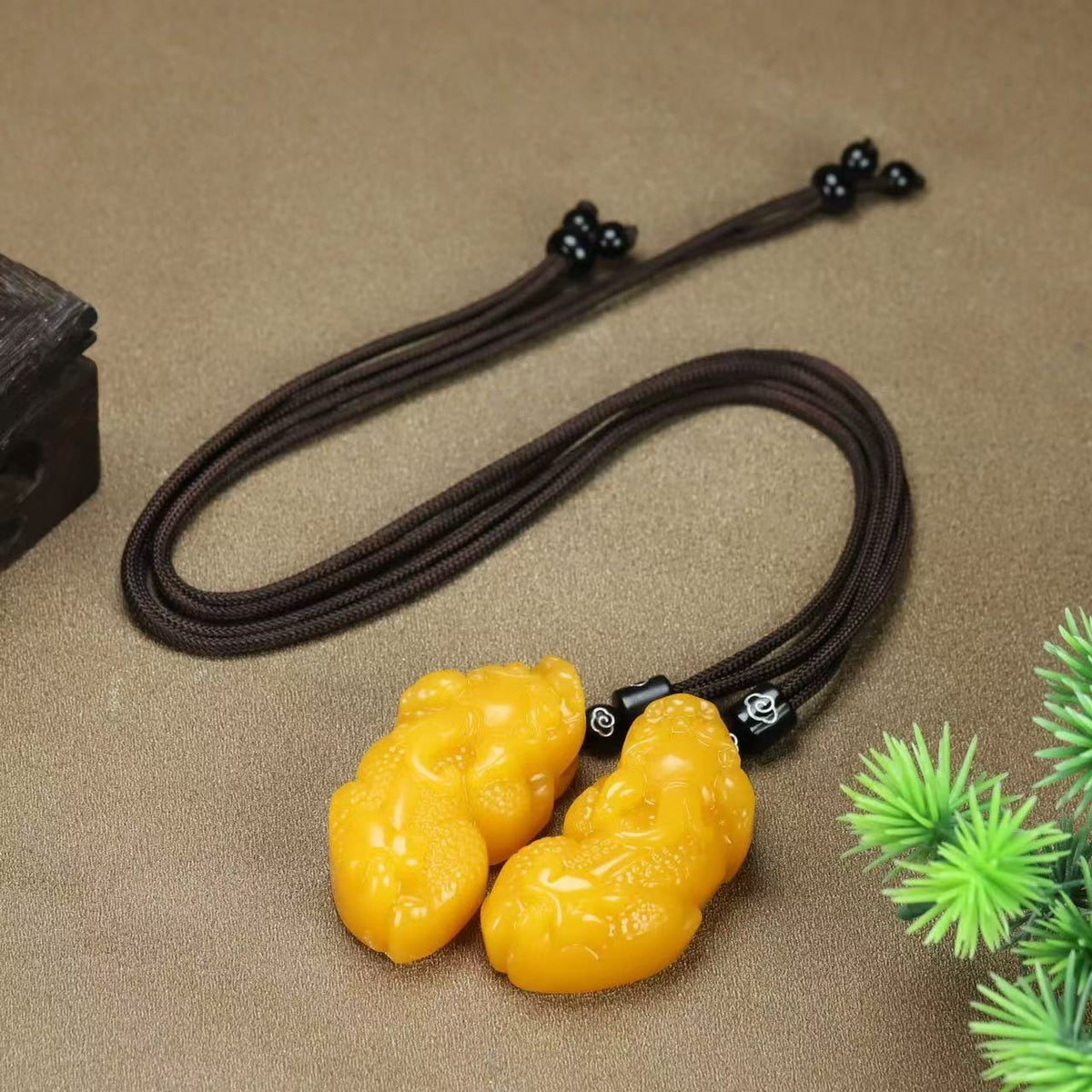 Golden yellow Pixiu pendant necklace with braided cord