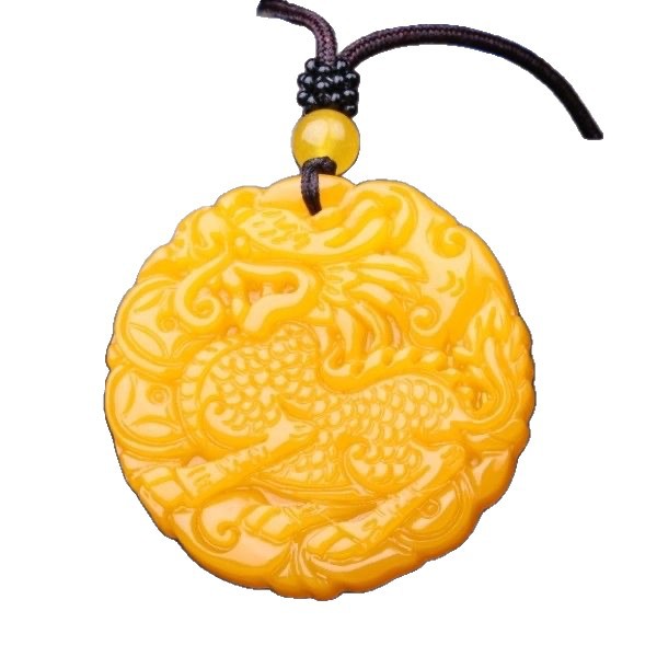 Golden yellow carved Qilin round pendant on white background