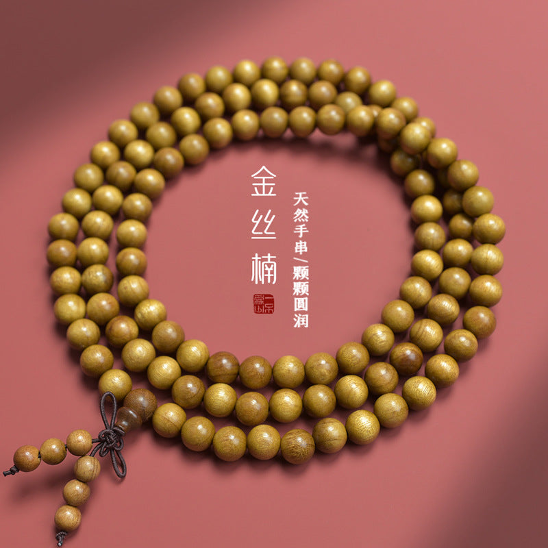 Golden-thread nanmu-style 108-bead prayer strand showing polished natural wood grain