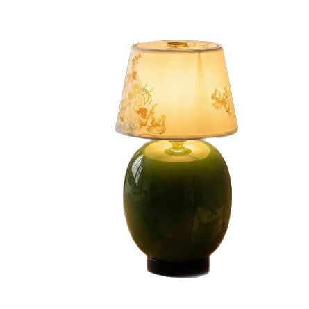 Front product view of green ceramic touch lamp with floral fabric shade