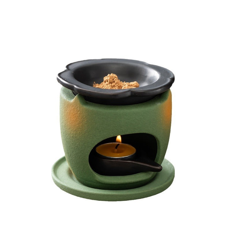 Ceramic indirect heat incense warmer on white background