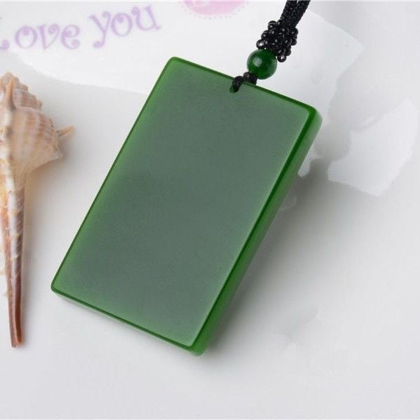 Green Guan Gong martial wealth god pendant isolated on white background