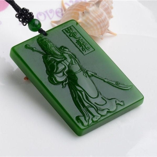 Deep green Chinese Guan Yu pendant showing carved warrior and inscription