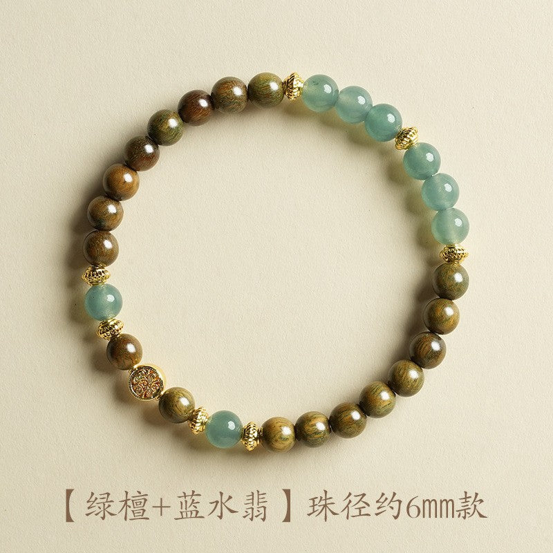 Green sandalwood-style bracelet with pale blue jade-tone beads, approximately 6mm, fortune-tree style
