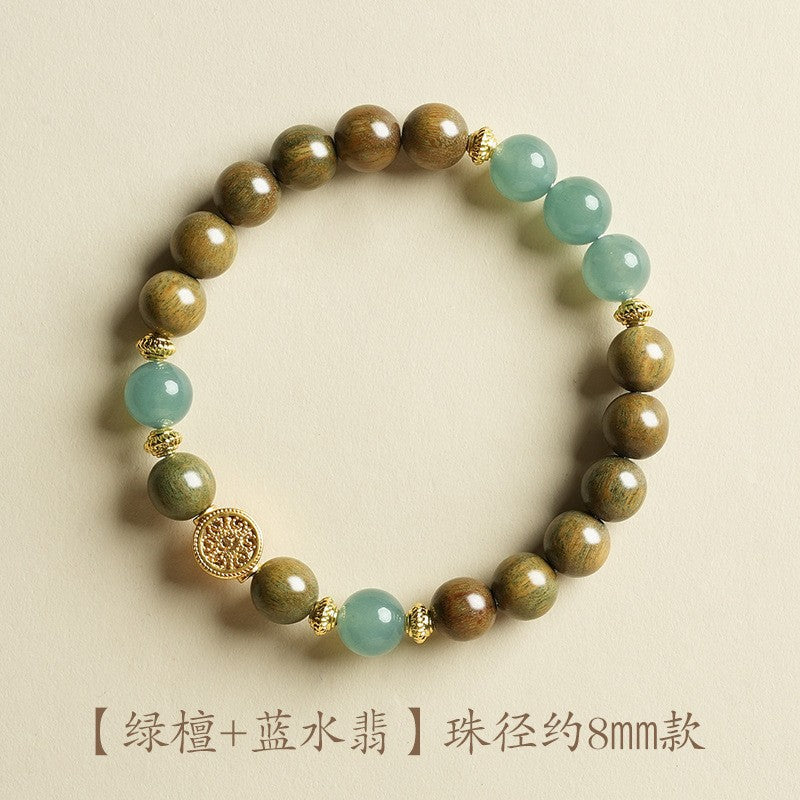 Green sandalwood-style bracelet with pale blue jade-tone beads, approximately 8mm, fortune-tree style