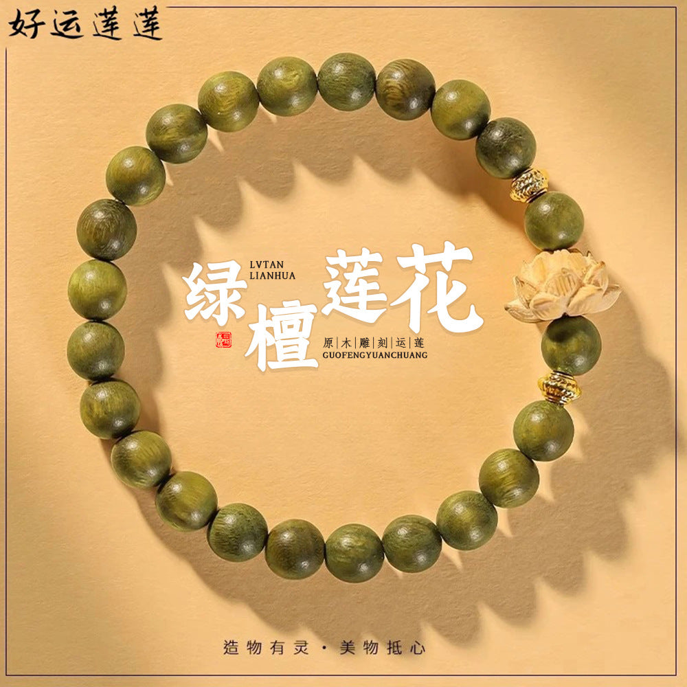 Green sandalwood-style bracelet with lotus focal charm, approximately 8mm beads