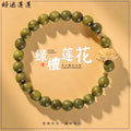 Green sandalwood-style bracelet with lotus focal charm, approximately 8mm beads
