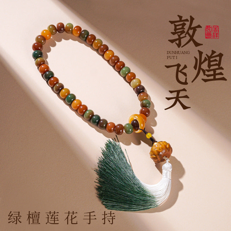 Green sandalwood-style hand mala with multitone wood beads lotus focal and green-white tassel