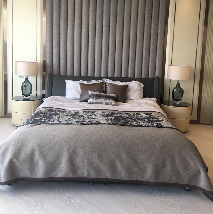 Pair of smoky green glass table lamps on bedroom nightstands