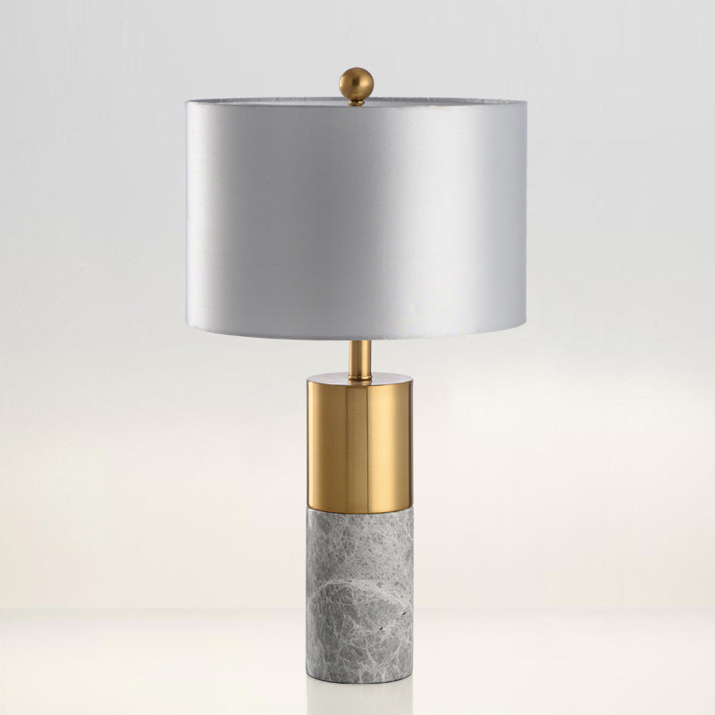 Grey natural marble column table lamp with brass body and grey drum shade