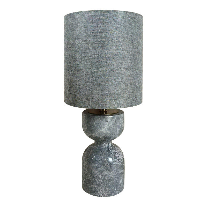 Grey stone hourglass table lamp with textured grey shade front view