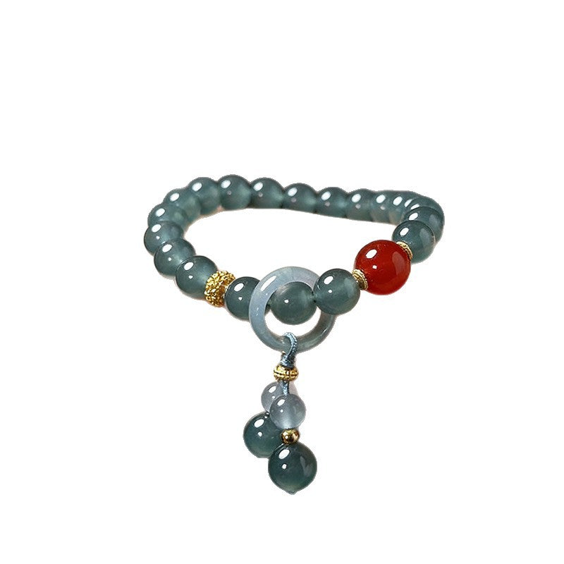 Guatemalan blue water jadeite bracelet with red agate accent and dangling jade detail