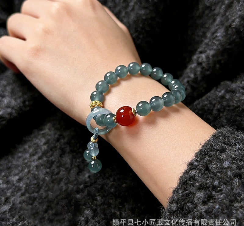 Blue water jadeite and red agate bracelet worn on wrist