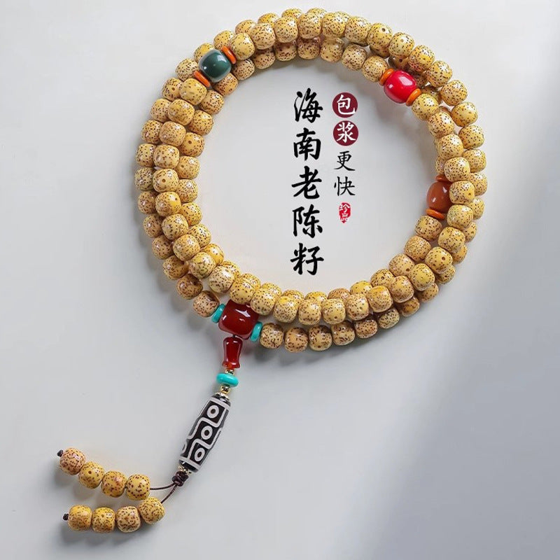 Hainan Xingyue Star Moon Bodhi golden seed double-wrap bracelet with green red accents and Dzi-style center tube
