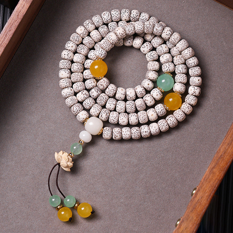 Natural white Hainan Xingyue Star Moon Bodhi 108-bead mala with yellow green red accents and pale carved charm