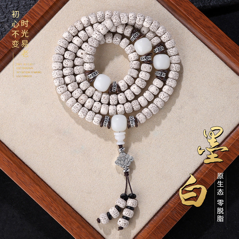 Natural white Hainan Xingyue Star Moon Bodhi 108-bead mala with white accents and silver-tone charm detail
