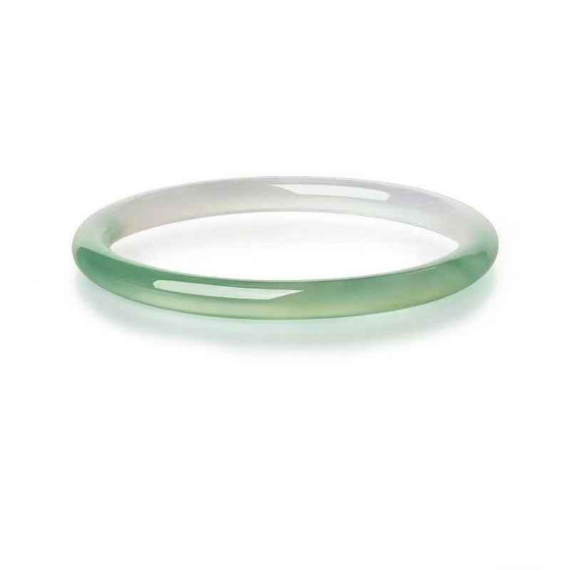 Icy pale green and white chalcedony slim round bangle close-up