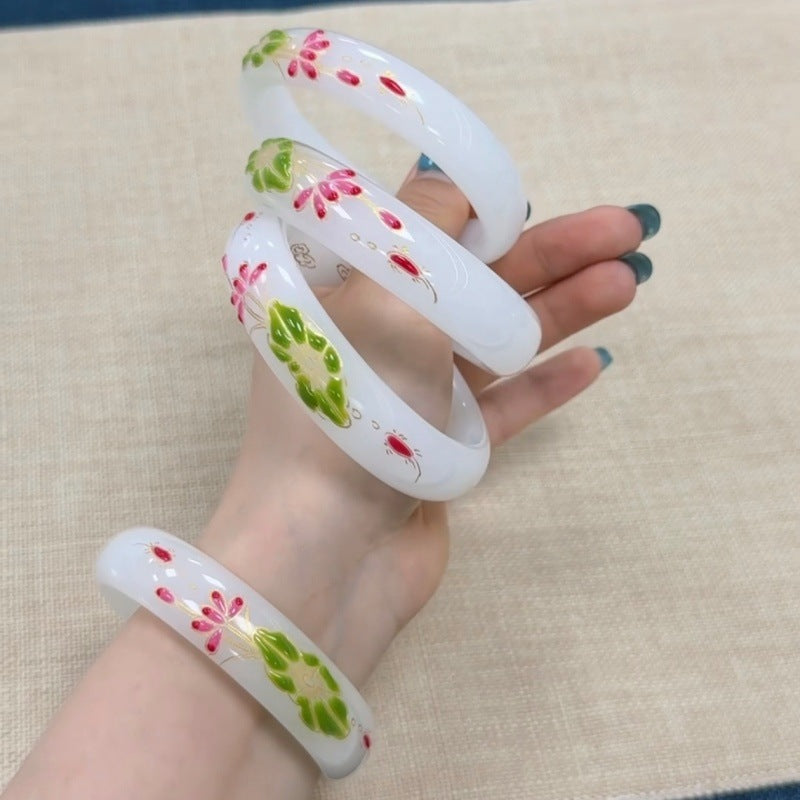 White floral stone bangle with lotus motif and polished finish