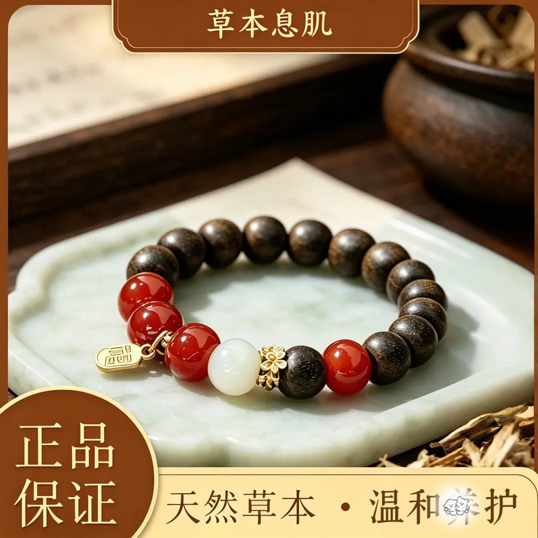 Herbal incense bead single-wrap bracelet with red and pearl-tone accents displayed on a pale tea tray
