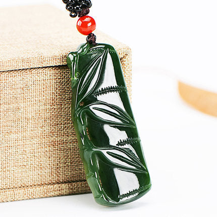 Hetian jade bamboo pendant in deep green Biyu nephrite with red bead