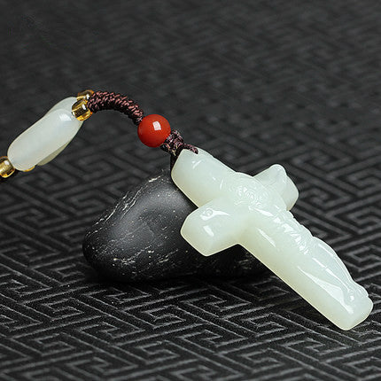Natural nephrite cross necklace with red bead and woven cord