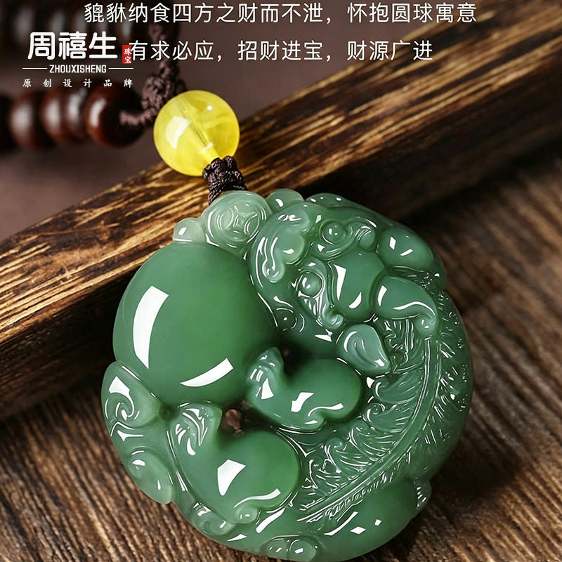 Dark celadon nephrite round Pixiu medallion showing deep relief carving
