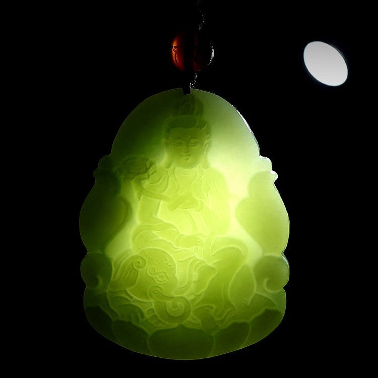 Hetian jade guardian Buddha pendant shown under transmitted light