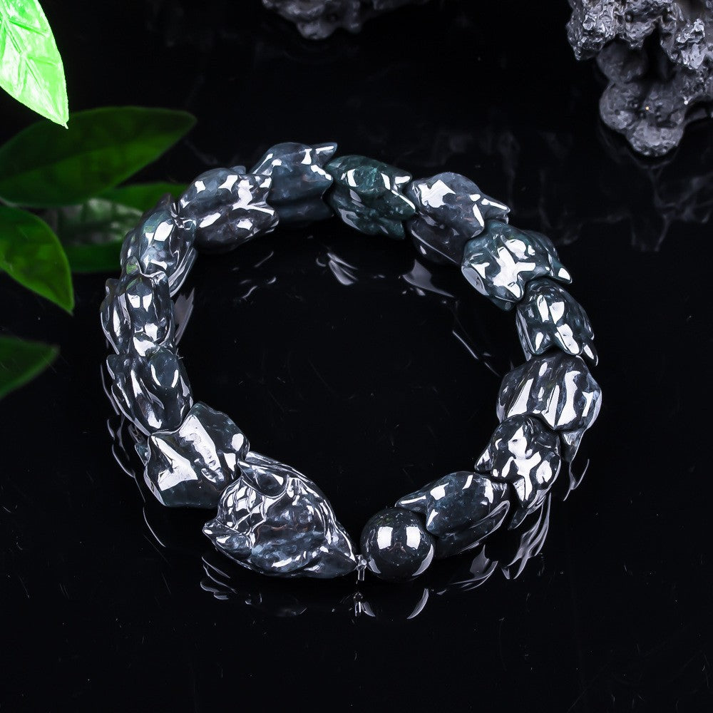 Certified natural jadeite dragon scale bracelet under studio light