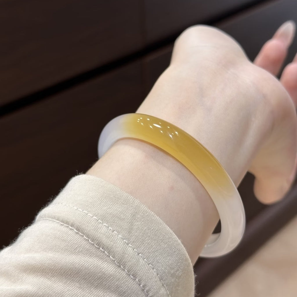 Honey yellow gradient agate chalcedony bangle styled on wrist