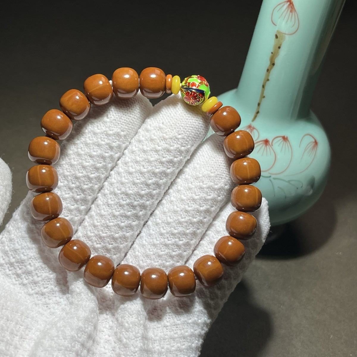 Houtou wenwan 8x9mm barrel bead bracelet with colorful decorative Lulu Tong focal bead and yellow accent discs