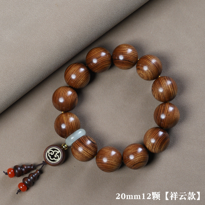 Huanghuali-style 20mm wood bead bracelet with auspicious cloud motif charm and red bead tassel accents