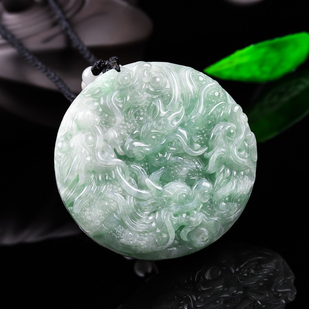 Double-sided natural jadeite dragon medallion pendant under light