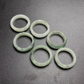 Icy pale green jadeite carved key fret rings showing traditional meander edge pattern