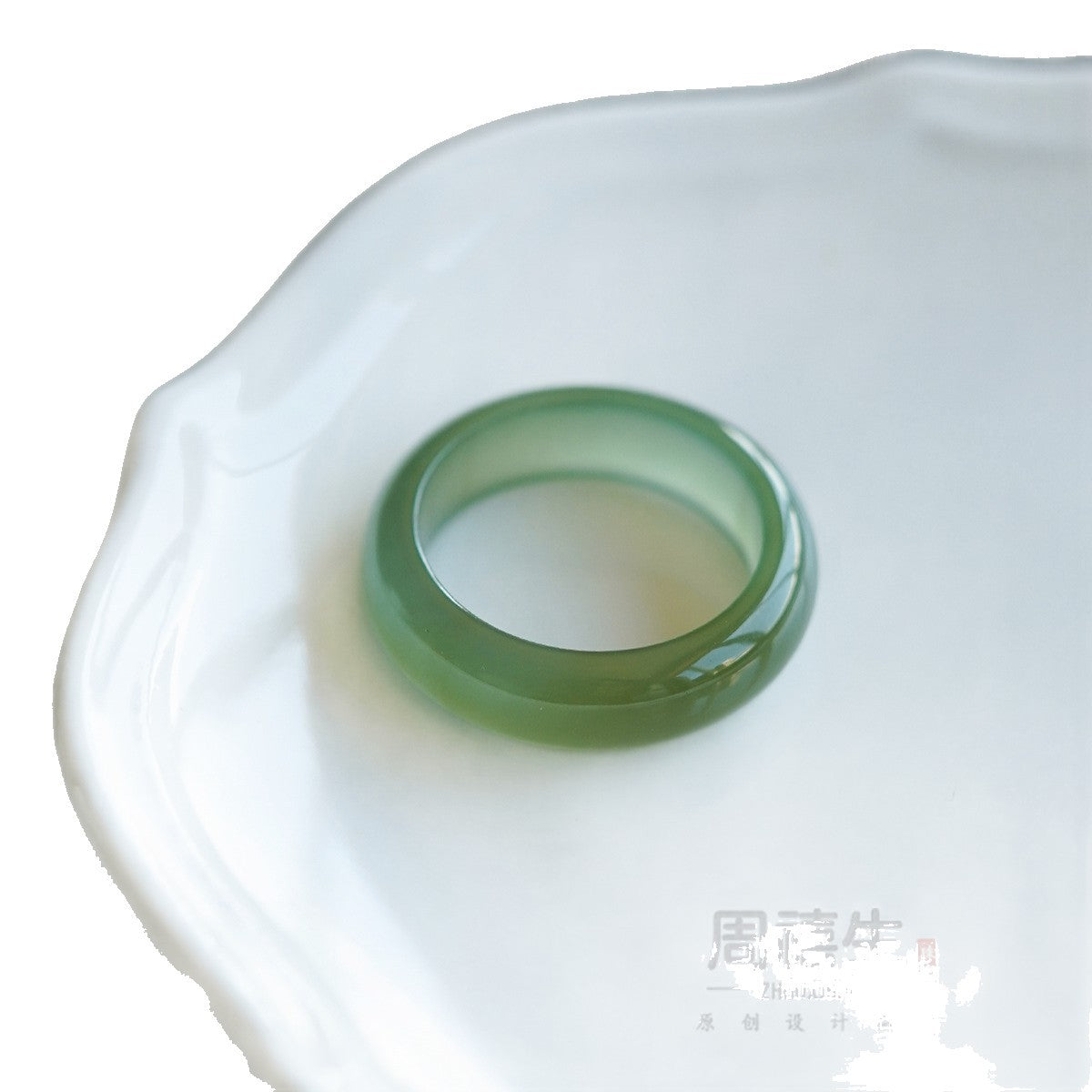 Hetian jade twist-carved ring showing rope-like relief detail