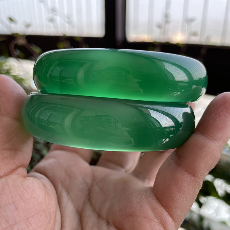 Wide green chalcedony bangles with saturated polished finish