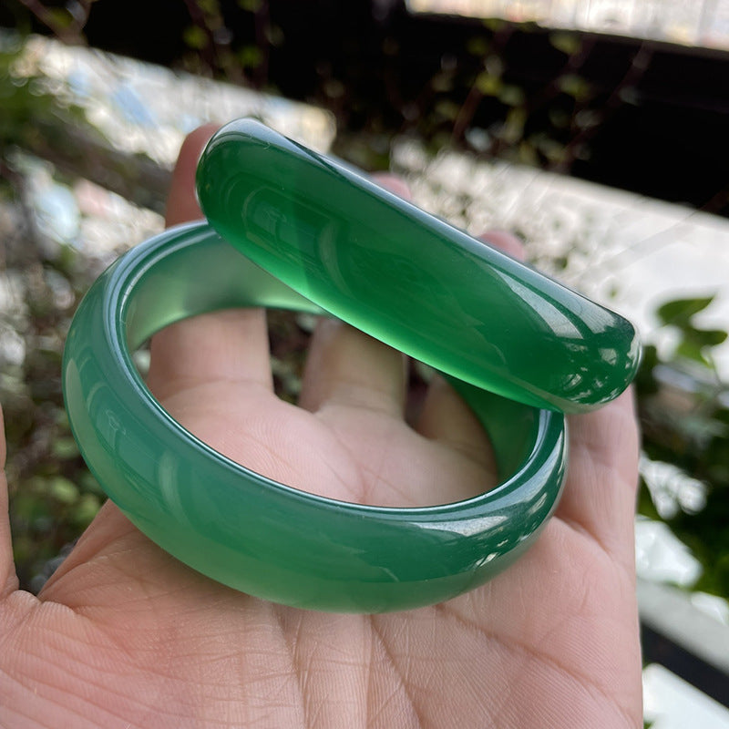 Vivid green chalcedony bangle pair with glossy hand polished surface