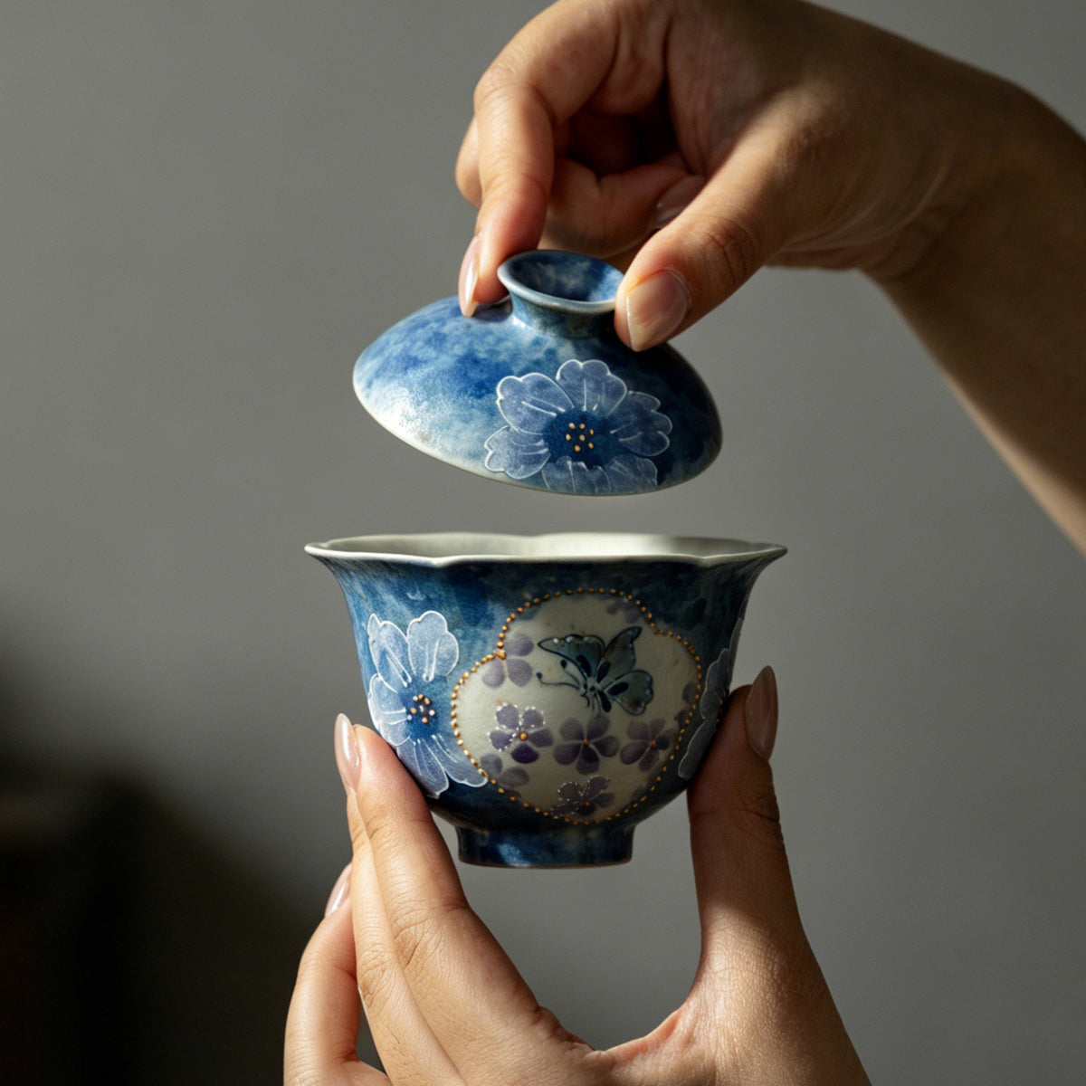 Hand-painted ink-blue butterfly floral Gongfu gaiwan viewed from the side