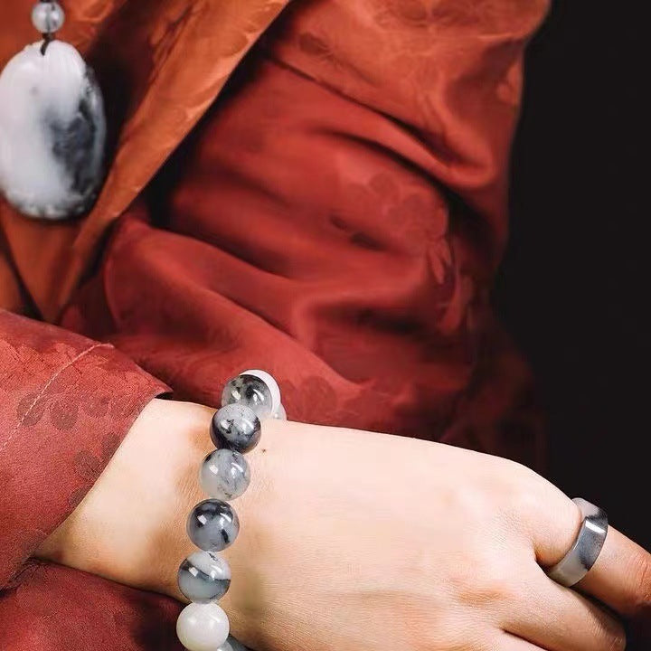 Ink-pattern black and white stone bracelet styled on wrist