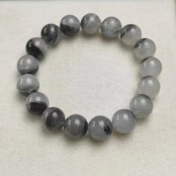 Grey black polished round bead bracelet top view
