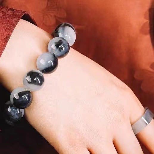 Chinese wenwan ink-pattern stone bracelet close wrist view