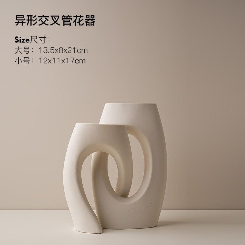 White interlocking loop ceramic vase set in modern sculptural style