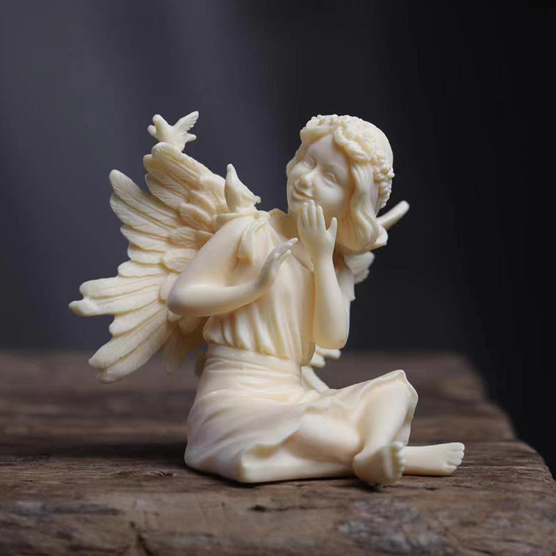Ivory nut beauty angel figurine decorative side view with sculpted wings